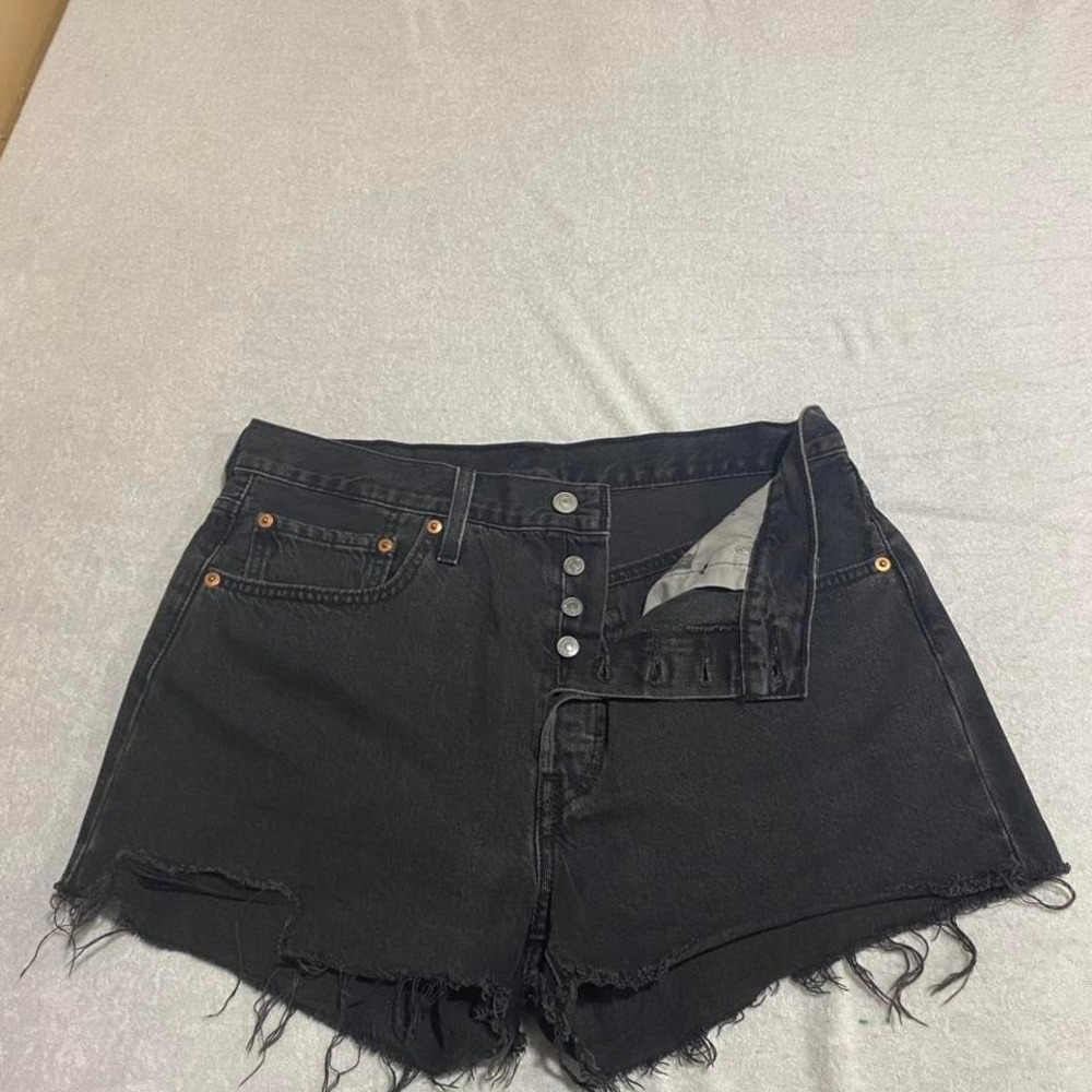 Black Levi's 501 Medium shorts have been cut.  #Levis501